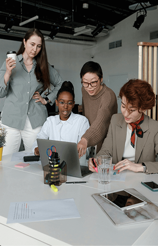 Group of people working around a table
